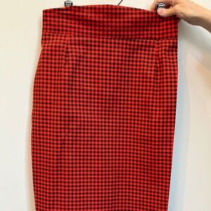Red-orange and black checkered plaid skirt